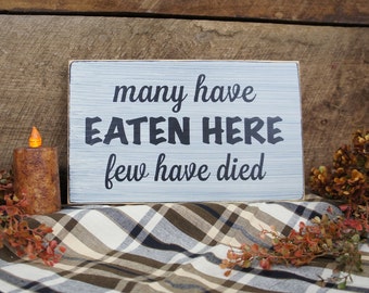 Many Have Eaten Here Few Have Died Kitchen Sign. Great Sign for a Chef, in a restaurant, or a kitchen.