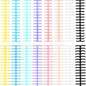 May include: A collection of plastic binding spines arranged in two horizontal rows. The spines are available in a variety of colors including yellow, blue, light blue, purple, pink, light pink, white, and black, each featuring multiple rings.