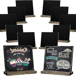 May include: A set of ten square black chalkboards with rustic wooden bases. Two boards feature colourful chalk illustrations and text, including the words Dessert, Macho Man, Be self confident, Be sweet, Smile a lot, and Tell her you love her.