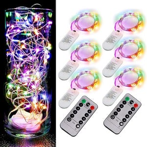 May include: A set of six multi-colored LED fairy light strands on thin silver wire, each with a white battery pack and two remote controls. The lights feature eight lighting modes, including combination, wave, sequential, and steady on settings.