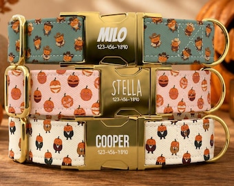 May include: Three pet collars with gold-tone metal buckles engraved with names and phone numbers. The top collar is teal with cowboy pumpkins, the middle is pink with various pumpkin faces, and the bottom is cream with pumpkins in suits.