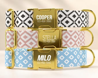 May include: Three pet collars with gold-tone metal buckles engraved with names and phone numbers. The top collar is black and white, the middle is dusty pink and white, and the bottom is light blue and white, all featuring geometric patterns.