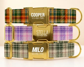 May include: Three pet collars with gold-tone metal buckles. The top collar is orange and green plaid with the text COOPER 123-456-7890. The middle is purple plaid with STELLA 123-456-7890. The bottom is green and white plaid with MILO 123-456-7890.