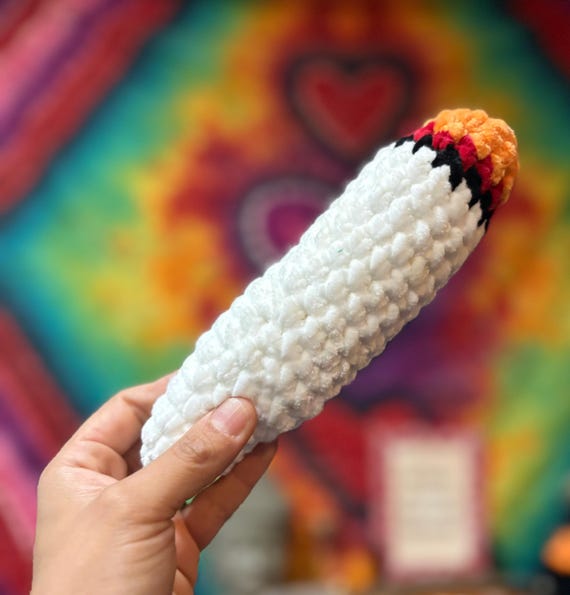 A meticulously crocheted joint — the audacity of making yarn weed this convincing is genuinely funny.