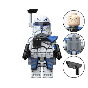 May include: A white and blue plastic toy soldier minifigure featuring a helmet with a rangefinder, a chest plate with black details, and blue leg markings. The set includes a separate head piece, a grey backpack, and a black handheld blaster.