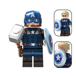 May include: A Captain America minifigure wearing a blue helmet with an A emblem, a dark blue suit with a white star, and brown belt details. The figure holds a silver hammer and a round blue, white, and red shield. Includes alternate hair pieces.