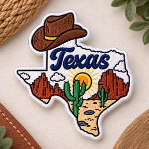 May include: An embroidered patch shaped like the state of Texas featuring a brown cowboy hat at the top, the word Texas in blue script, a yellow sun, green cacti, and red rock formations against a tan desert landscape with white clouds.