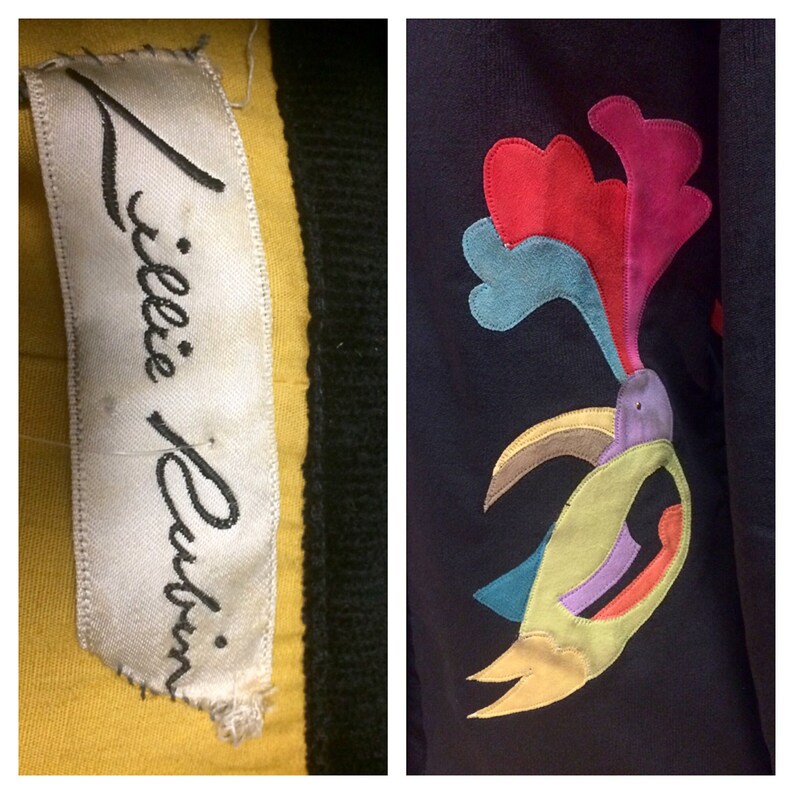 May include: A yellow sweater with a black trim and a white label that says "Tillie Rubin." The sweater has a colorful appliqu&eacute; of a bird with a long beak and a crest of feathers.