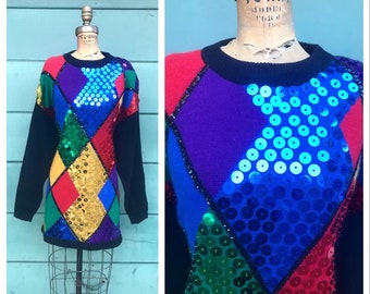 May include: A colorful sweater with a diamond pattern and sequins. The sweater is made of a soft, knit fabric and has a crew neck. The sequins are in various colors, including blue, green, red, and gold.