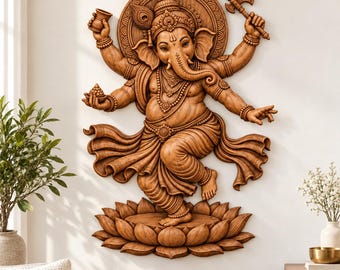 May include: A brown, carved wooden wall sculpture of the deity Ganesha depicted in a dancing pose. The figure has an elephant head, multiple arms holding objects, and is standing on a large, detailed lotus flower base with a circular halo.