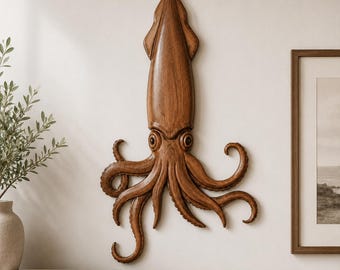 May include: A wall-mounted wooden sculpture of a squid with a smooth, polished brown finish. The piece features a long, tapered mantle and multiple curved, textured tentacles extending outward, showcasing detailed wood grain patterns throughout.