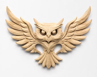 May include: A light brown wooden wall carving of an owl with its wings fully spread. The owl features detailed feather textures, pointed ear tufts, and large, forward-facing eyes. The carving is symmetrical, showcasing natural wood grain patterns.