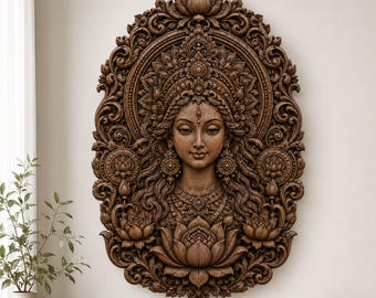 May include: A dark brown wooden wall carving featuring a detailed relief of a deity with an ornate headdress and jewelry. The figure is framed by intricate floral and scrollwork patterns, with a large lotus flower at the base and sides.