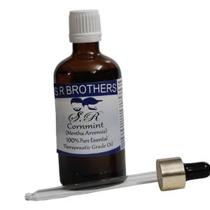 May include: A brown glass bottle with a white cap and a label reading S.R BROTHERS S.R Cornmint (Mentha Arvensis) 100% Pure Essential Therapeutic Grade Oil, accompanied by a glass dropper with a gold-coloured collar and a black rubber bulb.