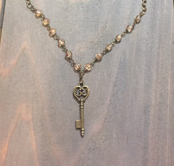 Items similar to Antique Brass Skeleton Key Necklace, Honey Tan Glass