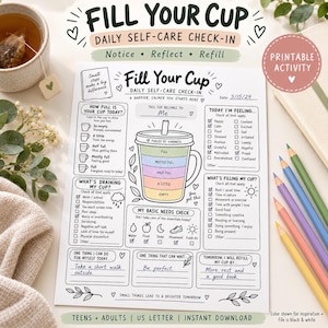 May include: A white paper sheet titled Fill Your Cup Daily Self-Care Check-In featuring a central cup illustration, checkboxes for feelings, daily needs, and prompts for reflection. The page includes handwritten text and decorative leaf accents.