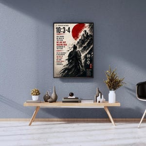 May include: A rectangular wall poster featuring a samurai figure in black armor standing before a large red sun and a mountain landscape. The text reads 2 Corinthians 10:3-4 with the full verse in English and Japanese characters on the right side.