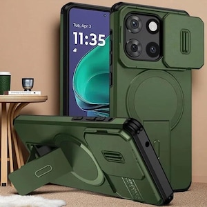 Könnte beinhalten: Eine olivgrüne Smartphone-Hülle mit verschiebbarer Kameraabdeckung, integriertem magnetischem Ring und ausklappbarem Ständer. Die Hülle hat schwarze Akzente an den Rändern und Tasten, wobei das Wort DISCOVER auf der Rückseite aufgedruckt ist.