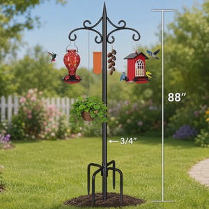 May include: A black metal bird feeding station with a 88-inch total height and a 3/4-inch pole diameter. It features multiple hooks holding a red glass hummingbird feeder, a hanging plant basket, a rectangular orange flag, pinecones, and a red birdhouse.