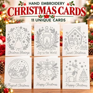 Può includere: Un set di biglietti d'auguri bianchi con motivi ricamati a mano in nero a tema natalizio, tra cui un angelo, una lanterna, una casa di pan di zenzero, una palla di neve, campane e una renna, con scritte come Christmas Blessings.