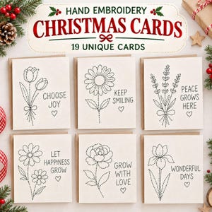 Peut inclure: Un ensemble de six cartes de vœux blanc cassé avec des motifs floraux et du texte brodés à la main en noir. Les cartes affichent des phrases telles que Choose Joy, Keep Smiling, Peace Grows Here, Let Happiness Grow, Grow With Love et Wonderful Days.