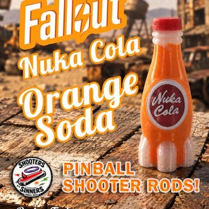 May include: A rocket-shaped orange Nuka Cola soda bottle with a red cap and a circular Nuka Cola logo. The text reads Fallout, Nuka Cola Orange Soda, Pinball Shooter Rods, Shooters Sinners Pinball Mods, and Order Today at etsy.com/shop/ShootersAndSinners.