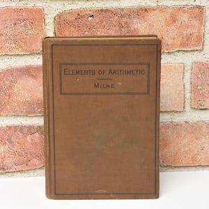 May include: A brown hardcover book titled "Elements of Arithmetic" by Milne.
