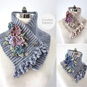 May include: A gray crocheted cowl with a floral design and two buttons. The cowl is displayed on a white mannequin. The image also shows two other versions of the cowl in beige and gray with different colored floral designs.