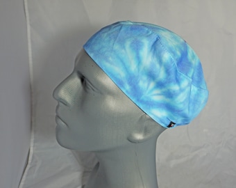 Bright blue chef skull cap.  Great for use in the kitchen.