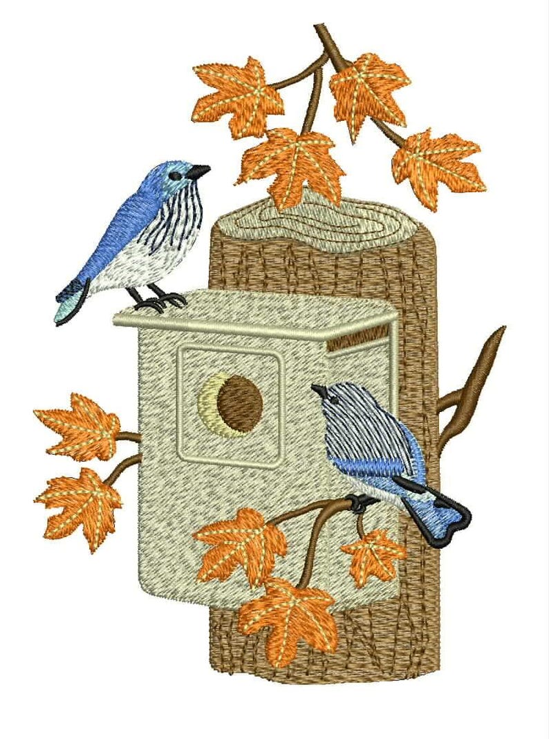 May include: An embroidery design featuring a light-colored wooden birdhouse mounted on a textured brown tree trunk. Two blue and white birds are perched on the structure, surrounded by orange maple leaves on thin brown branches.