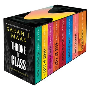 May include: A boxed book set titled Throne of Glass: The Complete Collection by Sarah J. Maas. The black box features white text and a forest graphic. Inside are eight colorful book spines with titles including The Assassin's Blade and Kingdom of Ash.