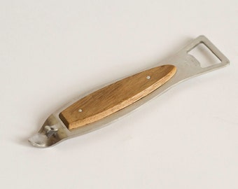 May include: A silver bottle opener with a wooden handle. The handle is a light brown color and has a smooth finish.