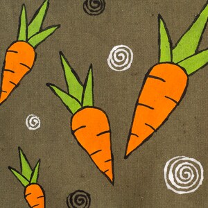 May include: A green canvas fabric with a repeating pattern of orange carrots with green tops and white and black swirl designs.