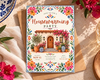May include: A rectangular housewarming party invitation card featuring a central illustration of a Spanish-style home with a wooden door, terracotta roof, and pink bougainvillea. The border displays colorful floral motifs and text reading Join Us For A Housewarming Party, Nov 15, 4:00 PM, The Sanchez Home, 123 Flores Lane, Los Angeles, CA, and RSVP by Nov 8, 555-123-4567.