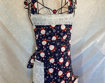 Apron reversible in adorable Holiday Cotton print, add Joy to your favorite special recipes... Ho Ho Ho