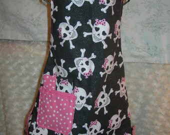 Girls reversible apron in Sparkly Skulls with Pink Bows and Dots, ready for those baking dates, Shine On