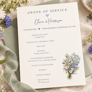 May include: A white wedding order of service card featuring the text ORDER OF SERVICE, the names Olivia & Harrison, and a date of 14th June 2028. The card includes a list of ceremony events and a watercolor illustration of a blue and yellow wildflower bouquet.