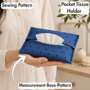 May include: A blue fabric pocket tissue holder featuring a small black square pattern. The rectangular holder has a central opening with a white tissue visible. Text on the image reads Sewing Pattern, Pocket Tissue Holder, and Measurement-Base-Pattern.