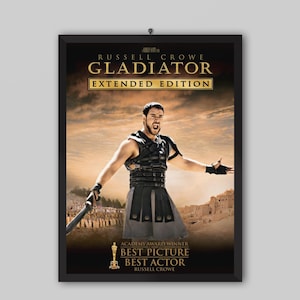 May include: A framed movie poster for the Gladiator Extended Edition featuring Russell Crowe in armor with a sword. The text reads Russell Crowe, Gladiator, Extended Edition, Academy Award Winner, Best Picture, Best Actor, and Russell Crowe.