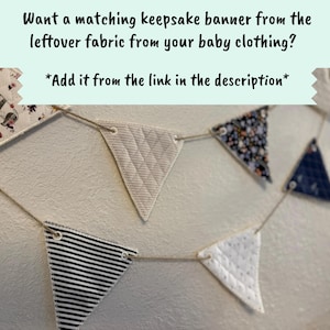 a decorative garland made of various fabric pieces, including striped and floral patterns, hanging on a wall.