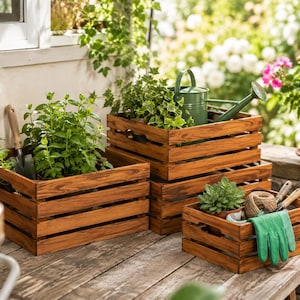 May include: A set of three rectangular wooden crates with horizontal slats and a natural brown finish. The crates contain green potted plants, a green metal watering can, a hand trowel, a ball of twine, and a pair of green gardening gloves.