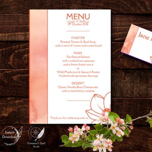 May include: A wedding menu card and a matching place card featuring a peach-colored watercolor side panel and a line-art flower illustration. The menu lists courses including roasted tomato soup, pan-seared salmon, and vanilla bean cheesecake.