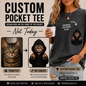 May include: A charcoal gray t-shirt featuring a chest pocket with a graphic of a tabby cat wearing a black hoodie and giving the middle finger. The text reads CUSTOM POCKET TEE, DESIGN GOES ON THE FRONT OF THE POCKET, Not Today, and ENLARGED FOR VIEWER TO SEE.