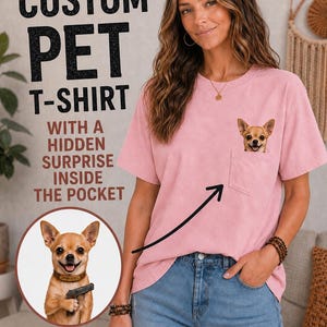 May include: A light pink short-sleeved t-shirt featuring a chest pocket with a graphic of a chihuahua peeking out. Text on the image reads: CUSTOM PET T-SHIRT WITH A HIDDEN SURPRISE INSIDE THE POCKET and YOUR PET HERE with a heart symbol.