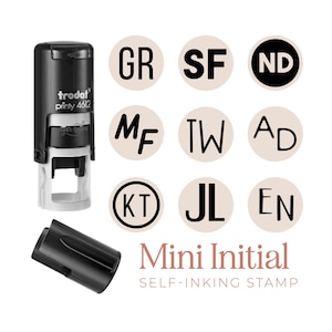 May include: A black and white Trodat Printy 4612 self-inking stamp with a removable cap. The image displays various two-letter initial combinations like GR, SF, ND, MF, TW, AD, KT, JL, and EN in circles. The text Mini Initial SELF-INKING STAMP is visible.