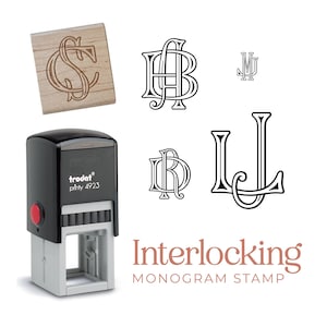 May include: A black and grey Trodat Printy 4923 self-inking stamp with a red button, a wooden block with an engraved CS monogram, and four black ink monogram designs featuring the letters AB, MJ, DR, and LJ, with the text Interlocking MONOGRAM STAMP.