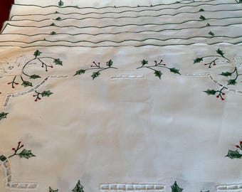 A set of 12 vintage Christmas embroidered 100% cotton holly table linens.
