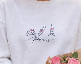Sudadera de París, suéter de cuello redondo con diseño de la Torre Eiffel y la baguette croissant, suéter de ciudad con lazo rosa coqueto, regalo de París para ella, suéter navideño de Francia