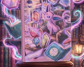 May include: A rectangular tablet case featuring a vibrant illustration of a purple Espeon character surrounded by floating books and glowing magical energy within a library setting, with a textured surface and rounded corners on a wooden stand.