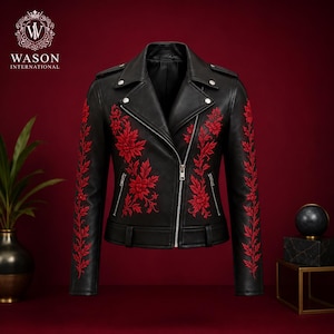 May include: A black leather motorcycle jacket featuring vibrant red floral embroidery on the front panels and sleeves. The jacket includes a silver-toned asymmetrical zipper, notched lapels with metal snaps, and two zippered pockets at the waist.